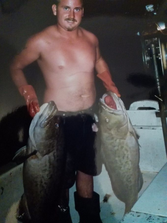 Austin with two black groupers commercial fishing days.